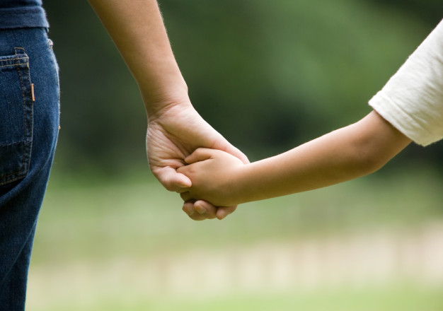 Mum son holding hands